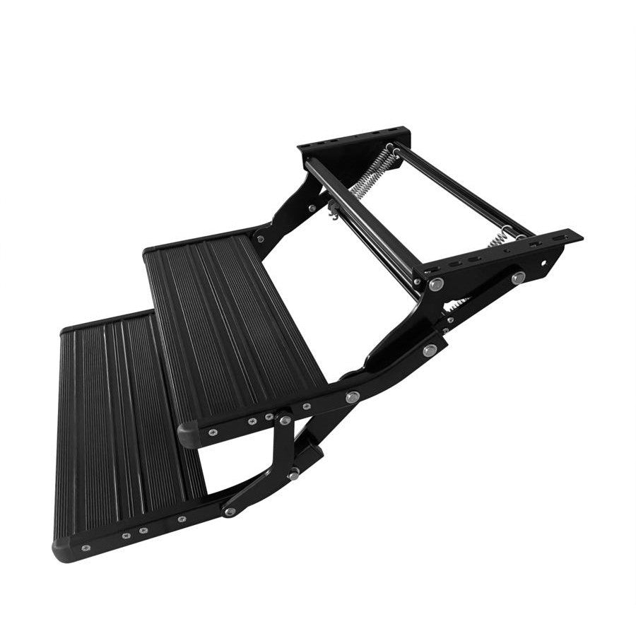 Black double caravan step folded closed, side view showing the folding arms, springs and mounting rail