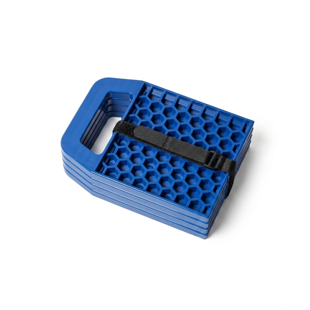 Four blue caravan stabiliser pads stacked and secured with a black strap