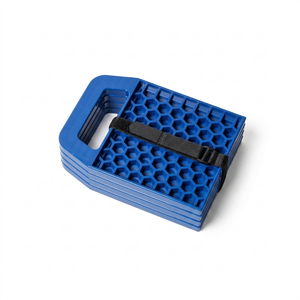 Four blue caravan stabiliser pads stacked and secured with a black strap