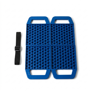 Underside of blue caravan stabiliser pad marked This Side Down with carry handle